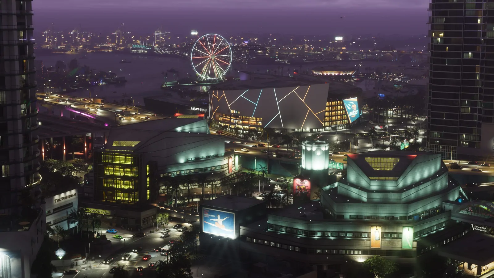 Vue plongeante sur le centre de Vice City la nuit : Sahara Arena, Vice City Arts Center, grande roue, port et trafic