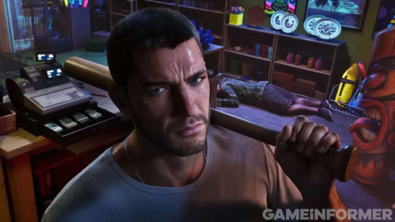 Gros plan sur Jason dans GTA 6, tenant une batte de baseball devant une caisse enregistreuse ouverte dans une boutique de souvenirs