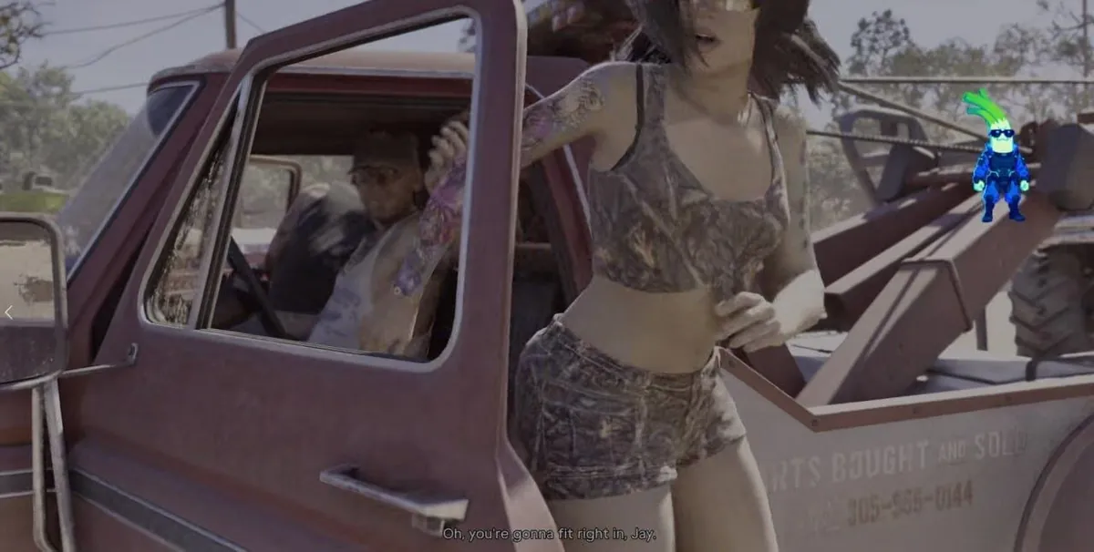 Cinématique : une femme tatouée en haut et short camouflage descend d'une dépanneuse, un homme au volant ; sous-titre « Oh, you're gonna fit right in, Jay. »